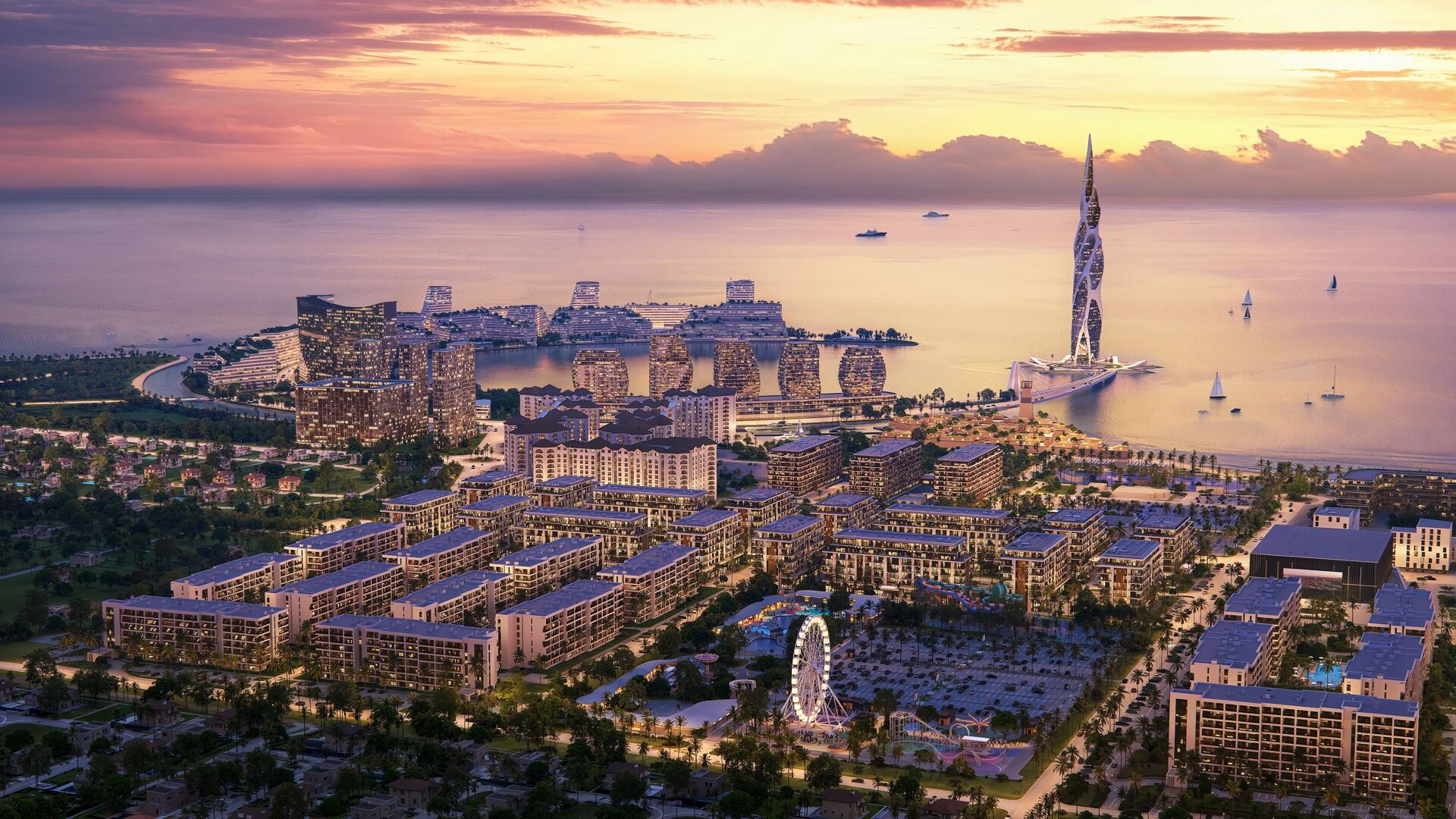 Aerial dusk panorama of Sea Breeze Baku — the landmark tower and waterfront